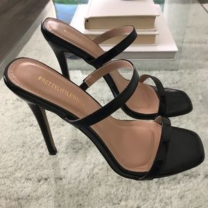 Pretty Little Thing black round heel shoes.